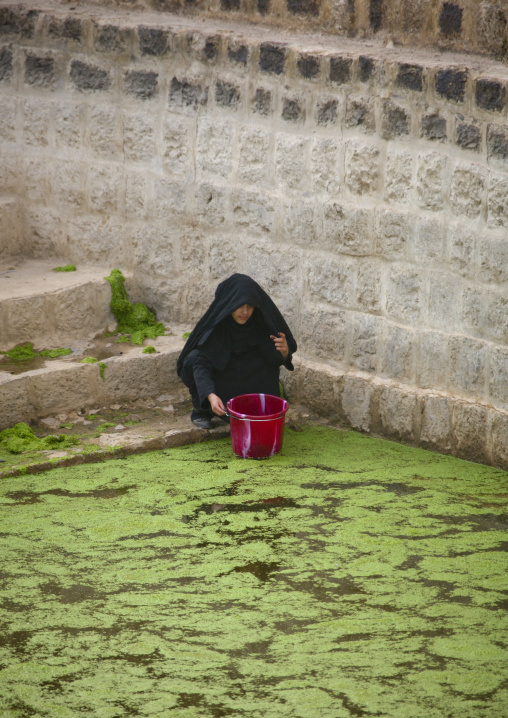 Woman Taking Water From A Cistern Covered By Lentils, Shahara, Yemen