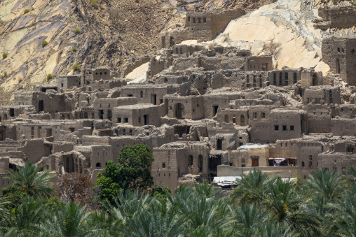 Close-up view of the tiered ruined mudbrick houses of the abandoned old village, Ad Dakhiliyah Governorate, Birkat Al Mouz, Oman