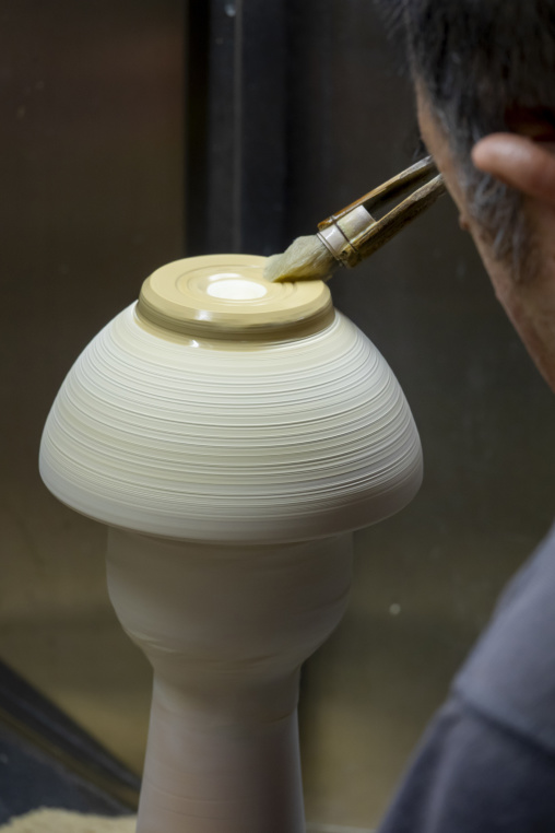 Artisan in Genemongama porcelain atelier, Kyushu region, Arita, Japan