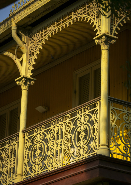 Sunlight illuminates the ornate cast-iron balcony columns and arch of the Palacio de Ferro, Luanda Province, Luanda, Angola
