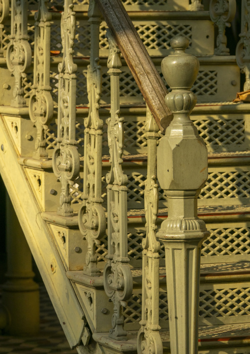Ornate cast-iron staircase balusters and a wooden handrail lead up to the Palacio de Ferro, Luanda Province, Luanda, Angola