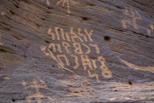 Ancient Thamudic inscriptions carved on a sandstone rock, Al Mad