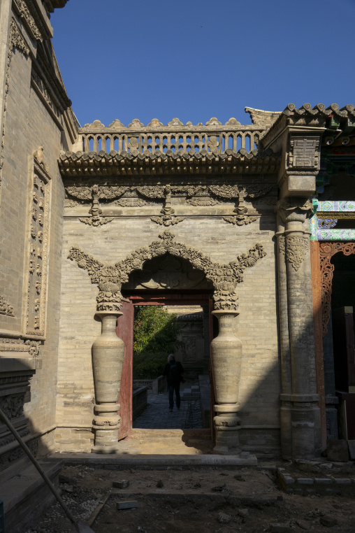 Carved stone vases flank a doorway at Dong Gong Guan mansion, Gansu Province, Linxia, China